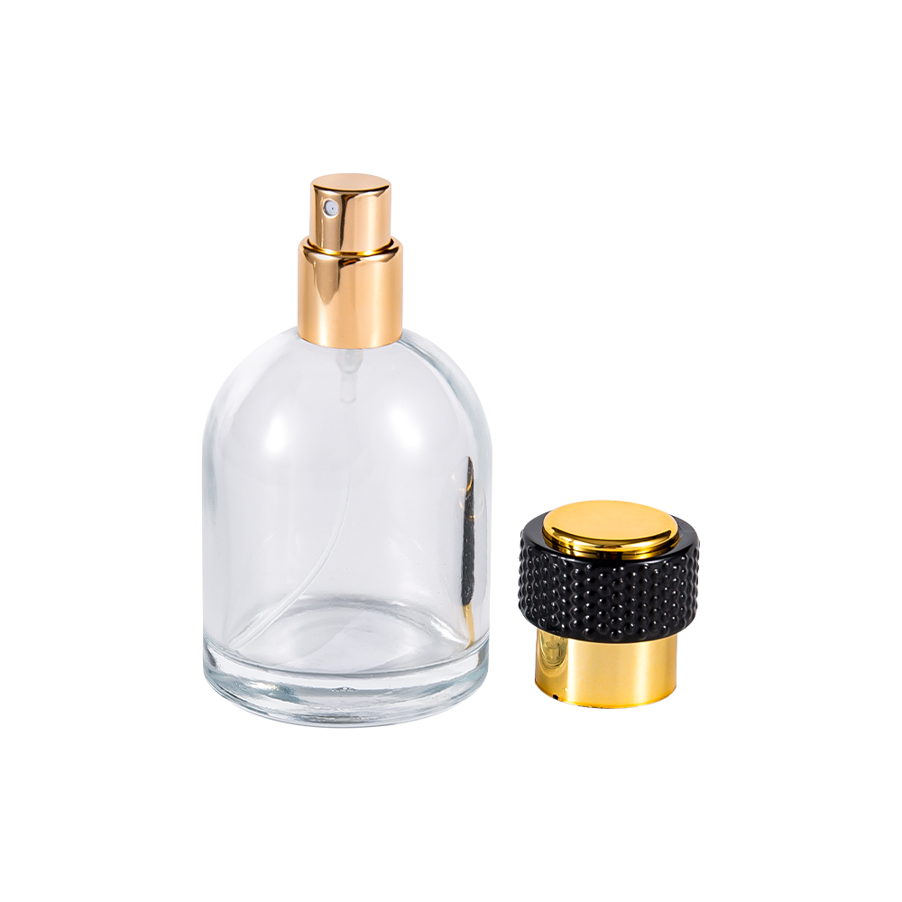 GC3986-WJ816 50 ml parfumeflaske i klart glas med Uv-guld plastikhætte og sort del